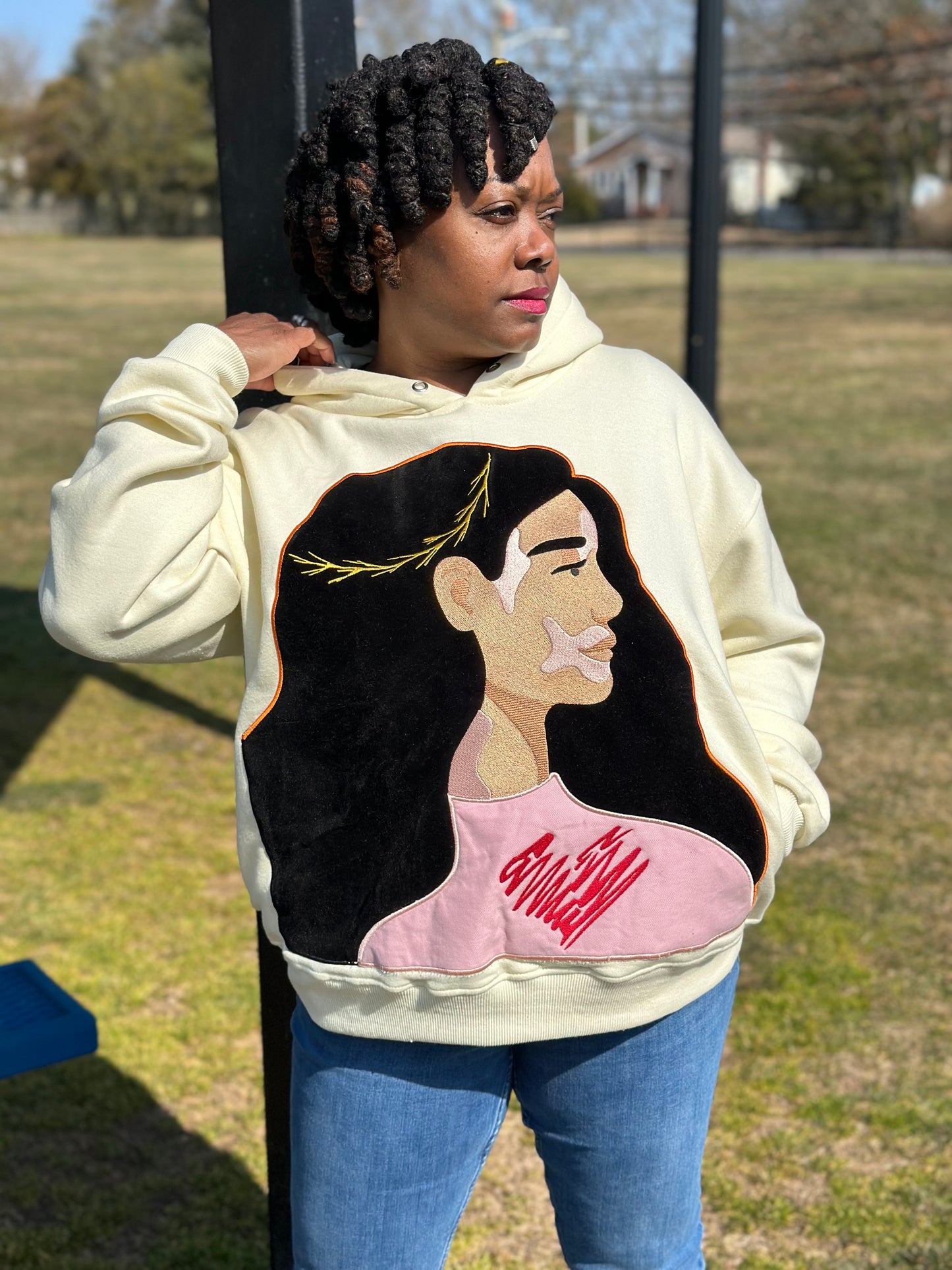 Female model wearing the Harlow "Love The Skin You're In" Hoodie