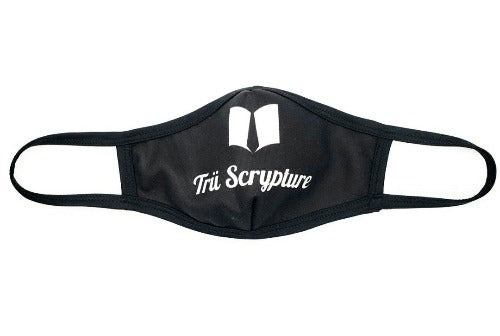A picture of the Trü Scrypture black face mask with the Trü Scrypture Fashion Book logo and name on the mask in white writing with black trim on the edges of the mask.