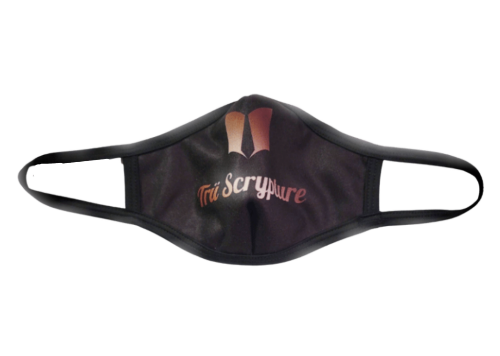A picture of the Trü Scrypture black face mask with the Trü Scrypture Fashion Book logo and name on the mask in rose gold writing with black trim on the edges of the mask.