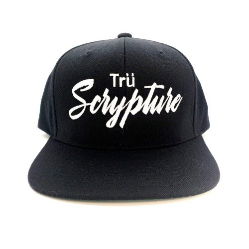 A picture of the black snapback cap with 3D embroidered "Trü Scrypture" on the front in a bold yet scripted font.