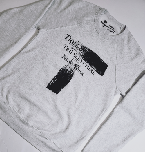 Picture of the Trüly Correct crewneck from a side angle showing the dimensions of the crewneck.