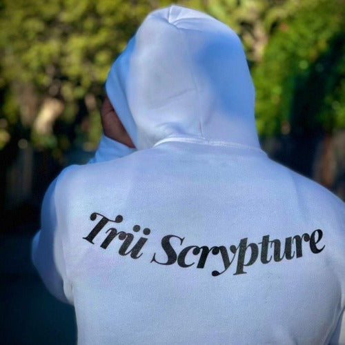 Model wearing the got trü hoodie in white from the back view.