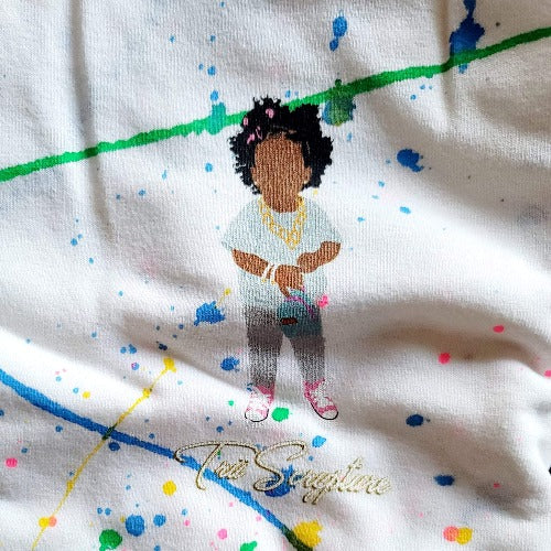 On this paint splattered  tee, the soon-to-be iconic Trü B-Girl stands over the alternate Trü Scrypture Gold Label logo.